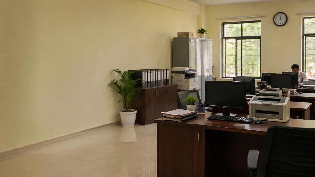 Government department administrative office workstation with files and laser printer